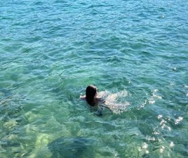 Girl swimming in Aegean Sea, Bodrum, Turkey